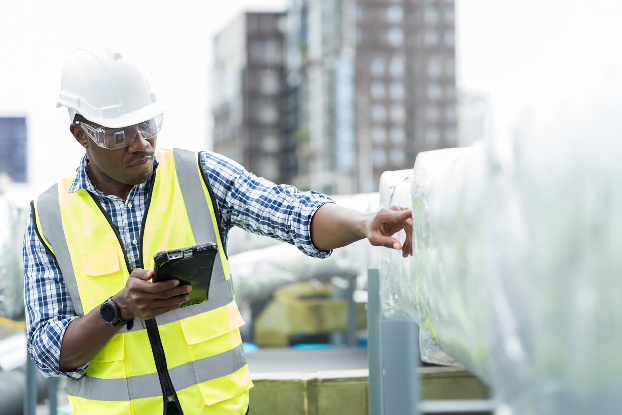 Engineer performing preventive maintenance on HVAC equipment